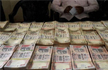 Four arrested with Rs 4.98 crore in banned currency